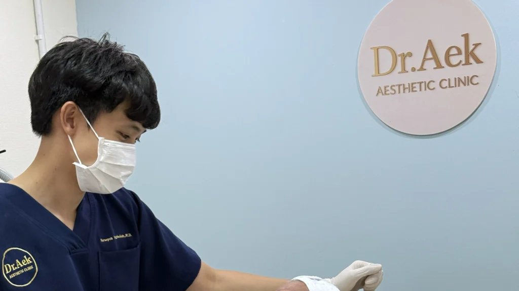 Dr. Aek consulting with a patient before treatment